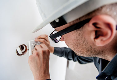 electrician installing an electrical switch