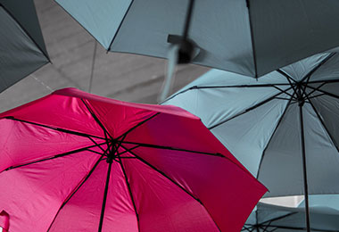 pink and black umbrellas floating