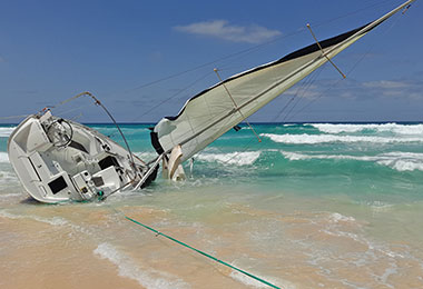 sailboat overturned on beach